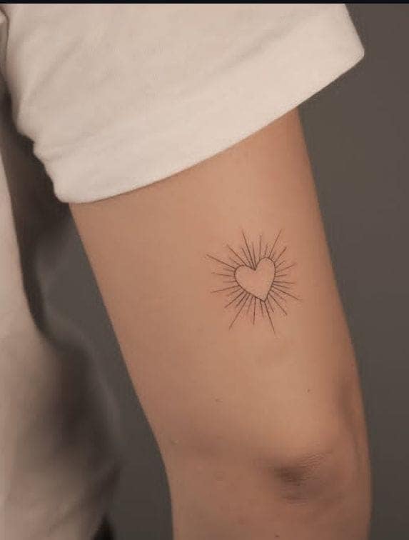 Minimalist Sunburst Heart Tattoo