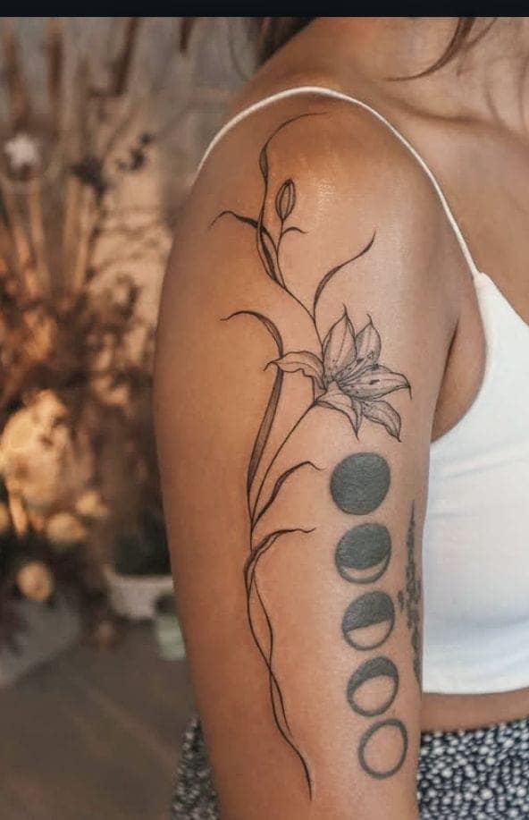 Dainty Lily Upper Arm Tattoo