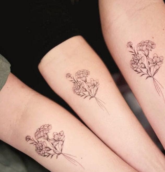 Identical Floral Bouquet Sister Tattoo Ideas