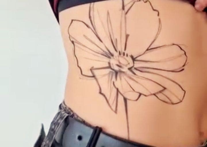 Single Poppy Rib Cage Tattoo