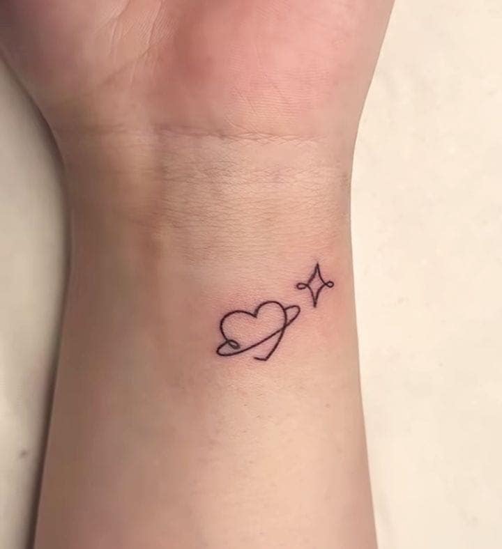 Celestial Heart Outline Wrist Tattoo