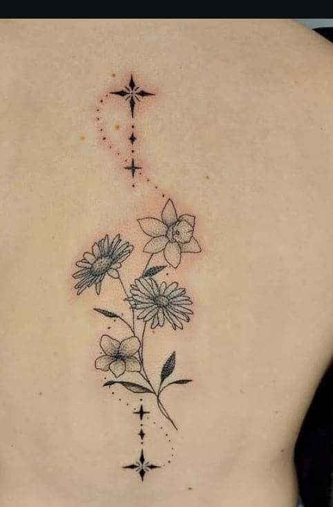 Celestial Flower Spine Tattoo
