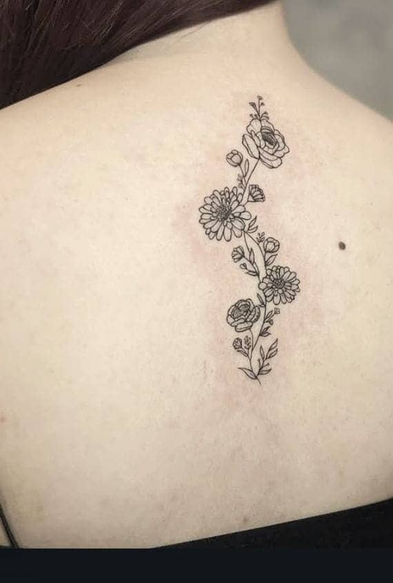 Mixed Floral Spine Tattoo Design