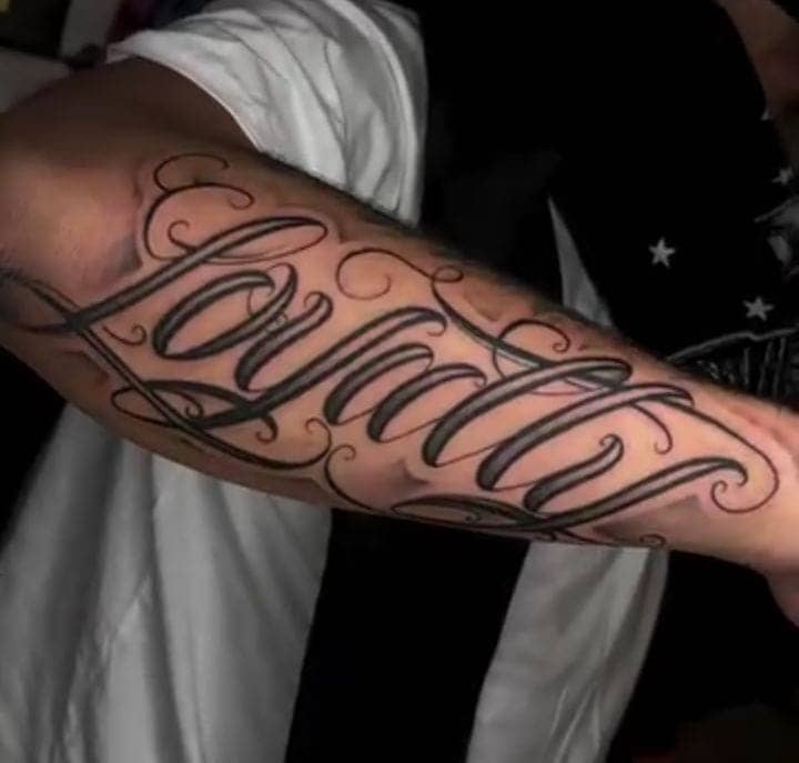 Forearm Script Loyalty Tattoo 