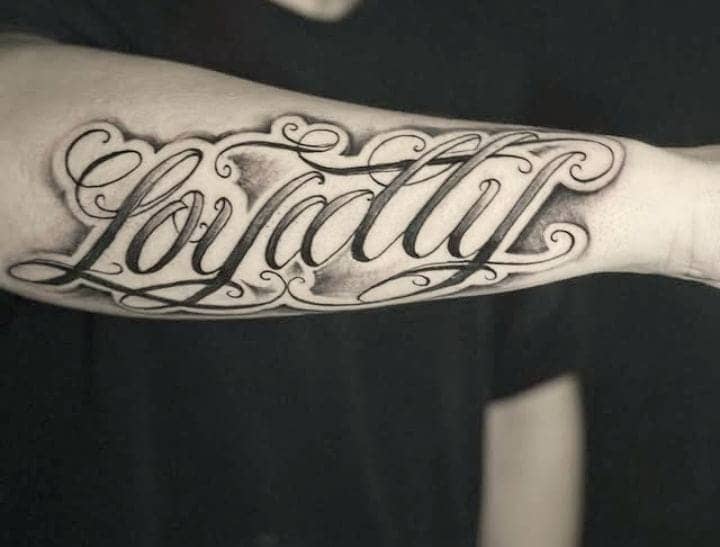 Shadowed Script Loyalty Inner Forearm Tattoo 