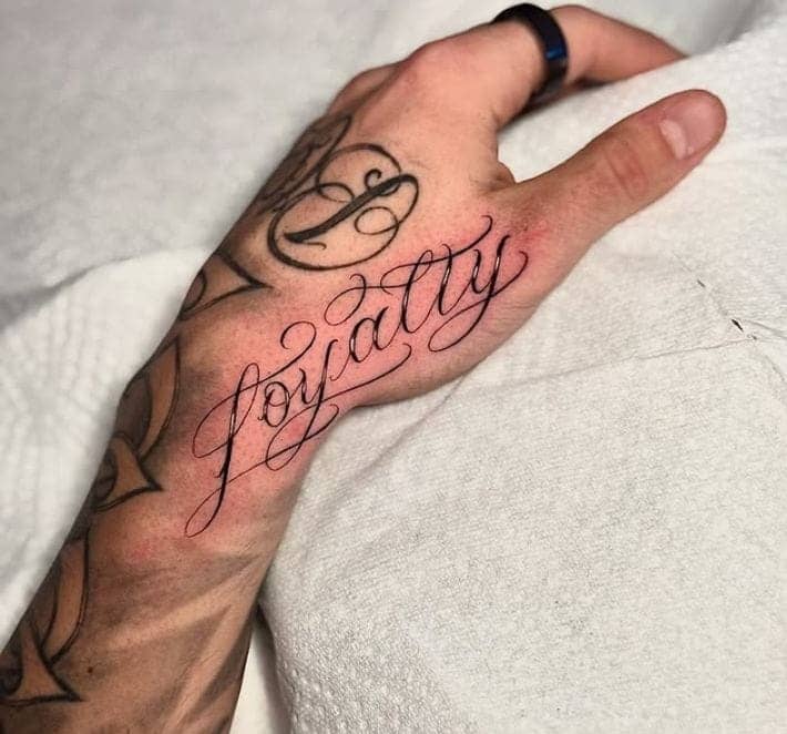 Side Hand Loyalty Script Tattoo 